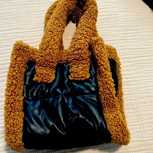 Stand studio bag, faux leather with brown Sherpa. Bag is about 10inch x 10 inch.